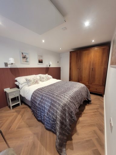 comfy bed in a farm-cottage-style bedroom
