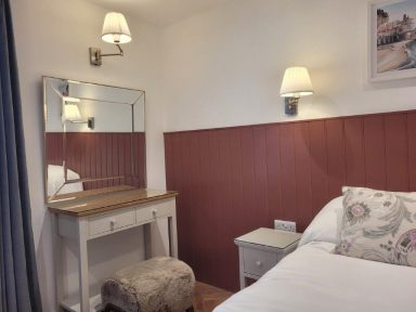 vanity in a cosy farm-style bedroom